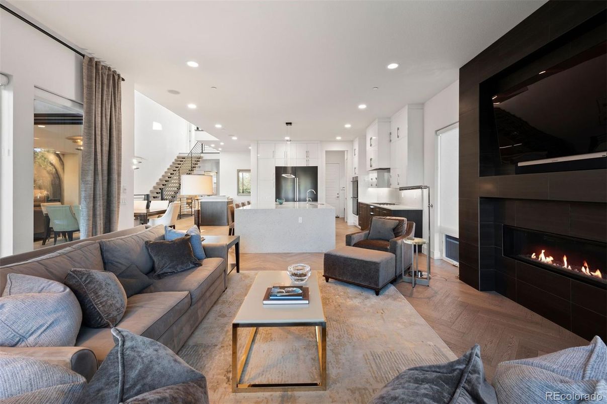 Fireplace, Interior, Kitchen, Living room, Pendant Lights, Recessed Lighting, Stainless Steel Appliances, Wood Texture Flooring