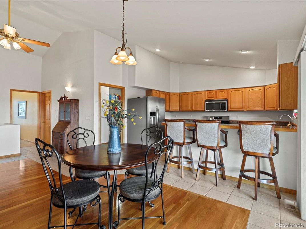 Dining room, Interior, Kitchen, Pendant Lights, Recessed Lighting, Stainless Steel Appliances, Wood Texture Flooring