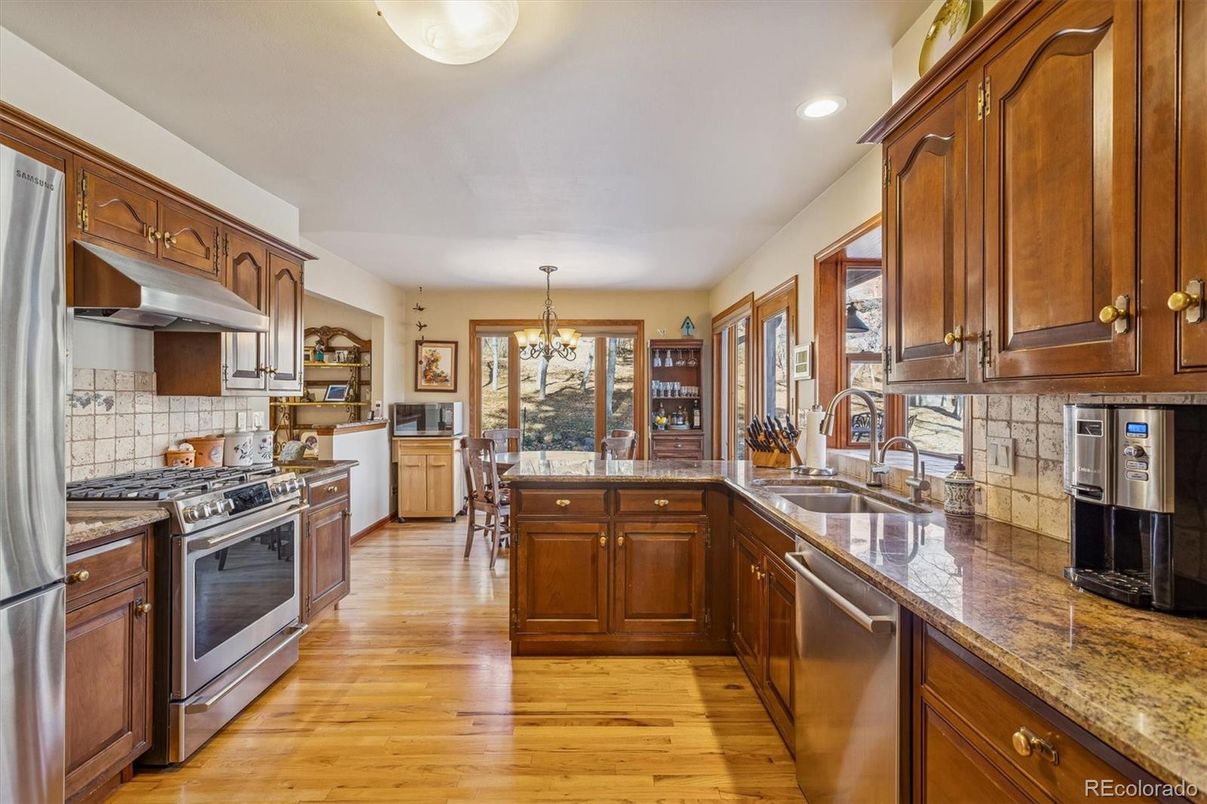 Chandelier, Dining room, Interior, Kitchen, Recessed Lighting, Stainless Steel Appliances, Wood Texture Flooring