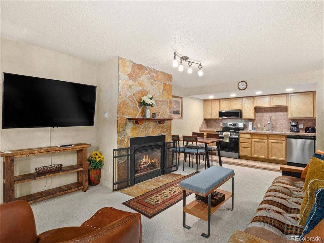 Dining room, Fireplace, Interior, Kitchen, Living room, Recessed Lighting, Stainless Steel Appliances, Stone Walls