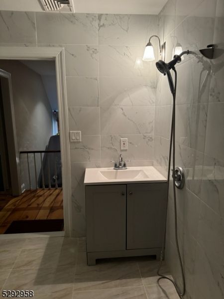 Bathroom, Glass Shower, Interior, Marble Walls, Wood Texture Flooring