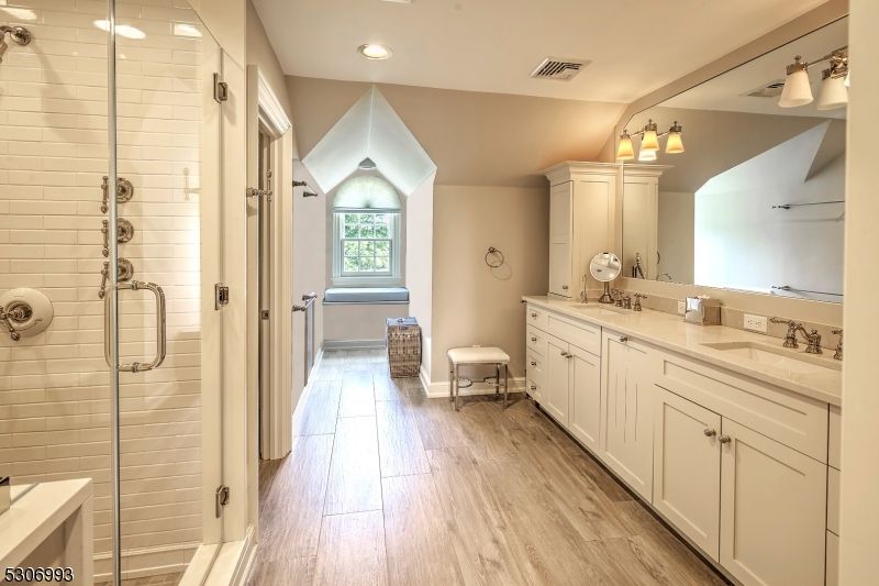 Bathroom, Dual Sink Vanities, Glass Shower, Interior, Recessed Lighting, Wood Texture Flooring