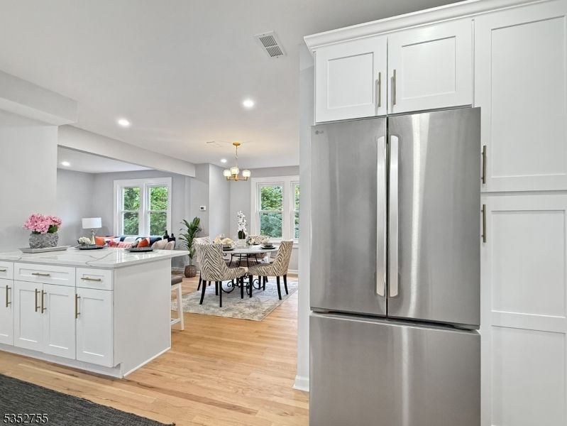 Chandelier, Dining room, Interior, Kitchen, Pendant Lights, Recessed Lighting, Stainless Steel Appliances, Wood Texture Flooring