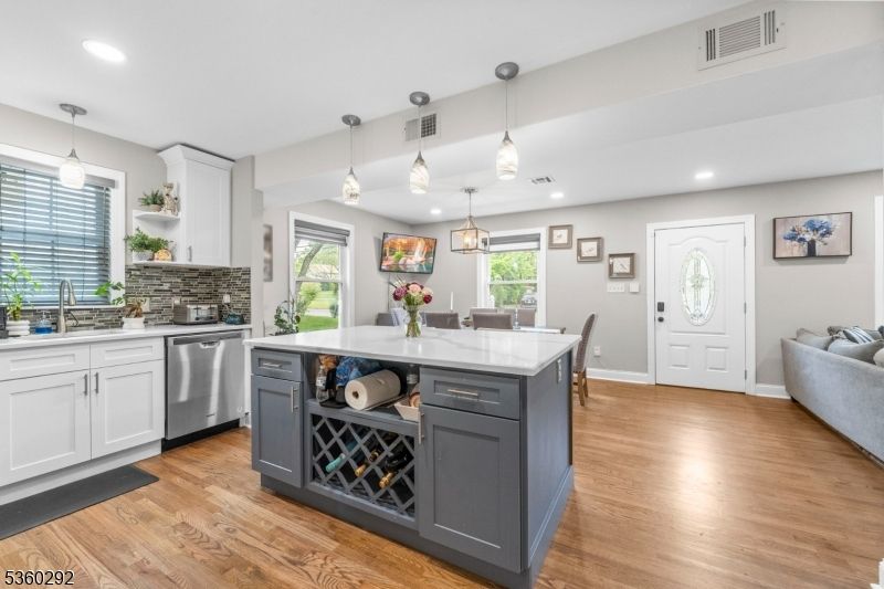 Dining room, Interior, Kitchen, Pendant Lights, Recessed Lighting, Stainless Steel Appliances, Wood Texture Flooring