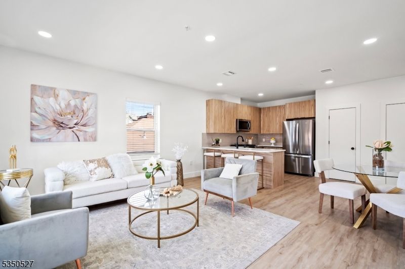 Dining room, Interior, Kitchen, Living room, Recessed Lighting, Stainless Steel Appliances, Wood Texture Flooring