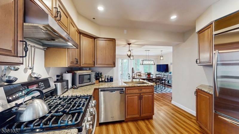 Dining room, Interior, Kitchen, Pendant Lights, Recessed Lighting, Stainless Steel Appliances, Wood Texture Flooring