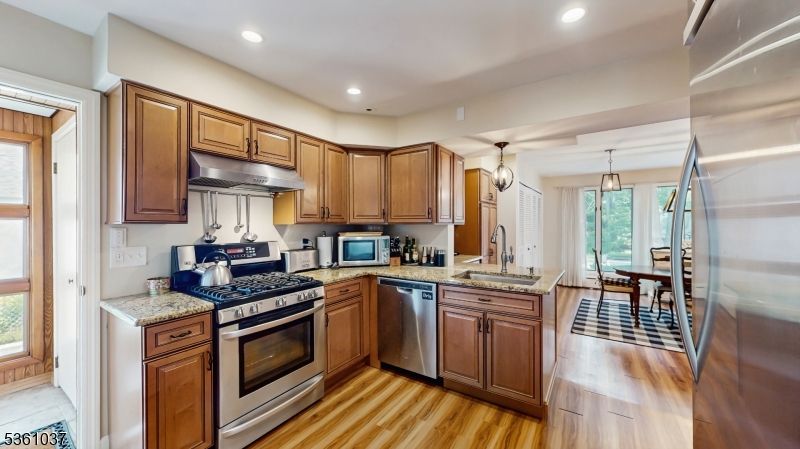 Dining room, Interior, Kitchen, Pendant Lights, Recessed Lighting, Stainless Steel Appliances, Wood Texture Flooring