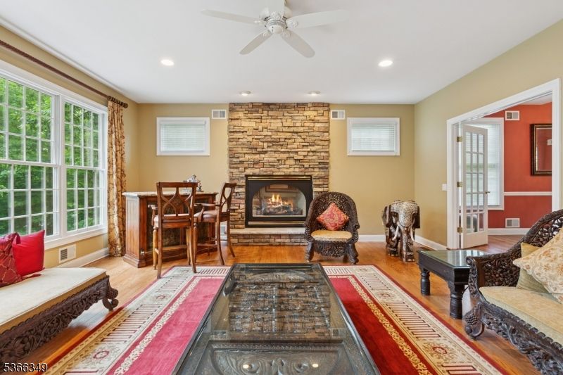 Fireplace, Interior, Living room, Recessed Lighting, Stone Walls, Wood Texture Flooring