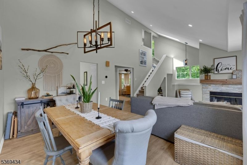Dining room, Fireplace, Interior, Living room, Pendant Lights, Recessed Lighting, Wood Texture Flooring