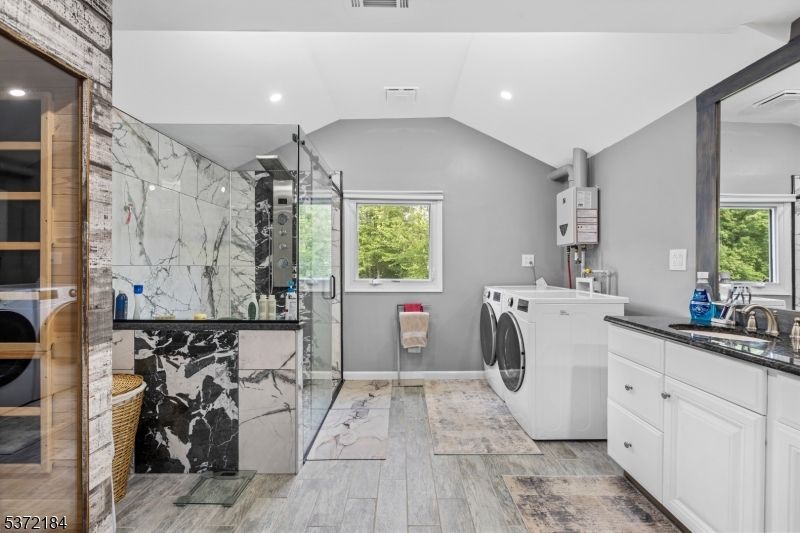 Interior, Marble Walls, Recessed Lighting, Washer, Wood Texture Flooring