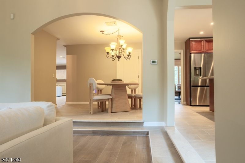 Chandelier, Dining room, Interior, Kitchen, Recessed Lighting, Stainless Steel Appliances, Wood Texture Flooring