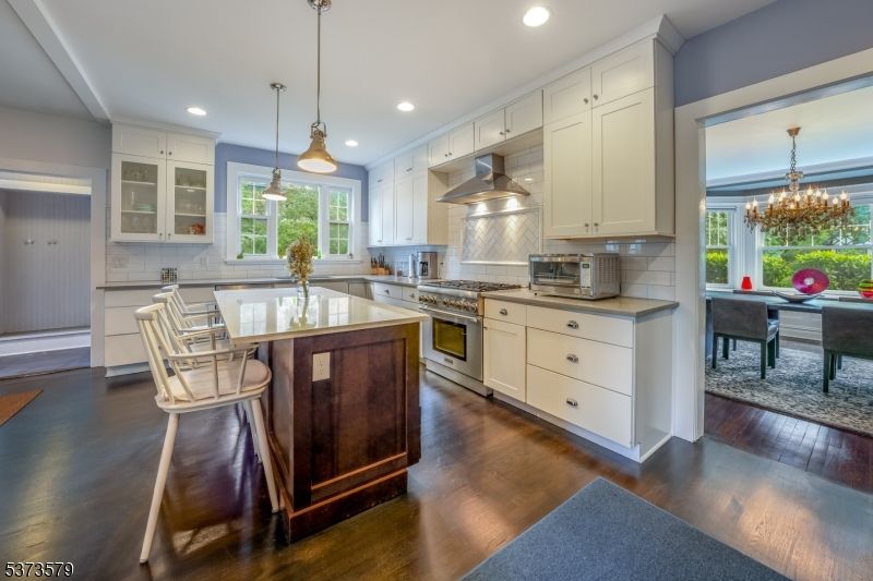 Chandelier, Dining room, Interior, Kitchen, Pendant Lights, Recessed Lighting, Stainless Steel Appliances, Wood Texture Flooring
