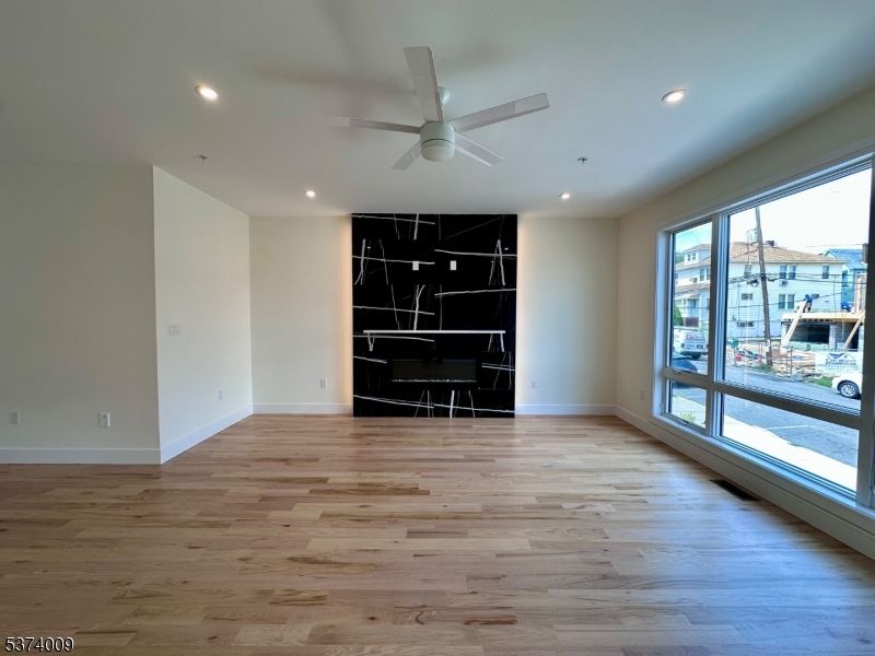Empty room, Fireplace, Interior, Recessed Lighting, Wood Texture Flooring