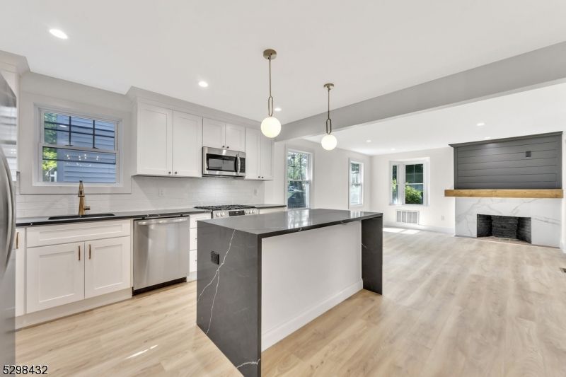 Fireplace, Interior, Kitchen, Pendant Lights, Recessed Lighting, Stainless Steel Appliances, Wood Texture Flooring