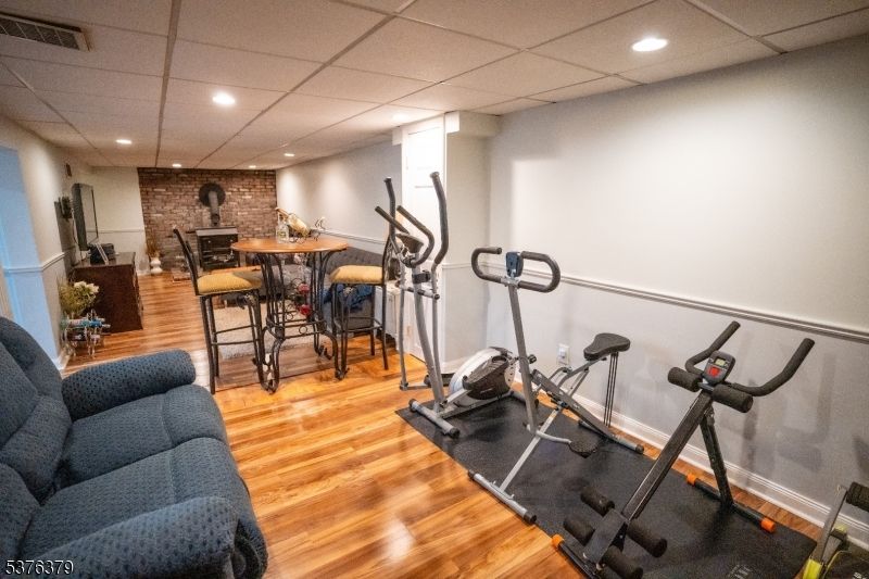 Dining room, Fitness Equipment, Interior, Recessed Lighting, Stone Walls, Wood Texture Flooring