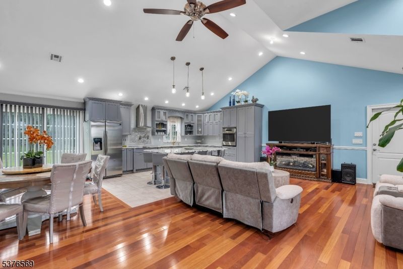 Dining room, Fireplace, Interior, Kitchen, Living room, Pendant Lights, Recessed Lighting, Stainless Steel Appliances, Wood Texture Flooring