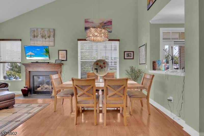 Dining room, Fireplace, Interior, Pendant Lights, Wood Texture Flooring
