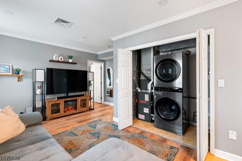 Interior, Living room, Recessed Lighting, Utility Closets, Washer, Wood Texture Flooring