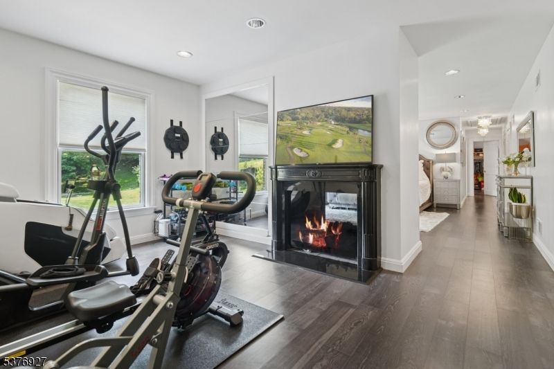 Fireplace, Fitness Equipment, Interior, Recessed Lighting, Wood Texture Flooring