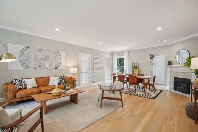 Dining room, Fireplace, Interior, Living room, Recessed Lighting, Wood Texture Flooring