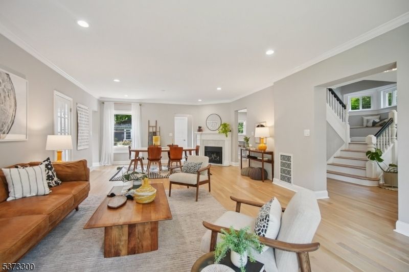 Dining room, Fireplace, Interior, Living room, Recessed Lighting, Wood Texture Flooring