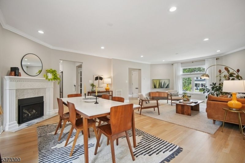 Dining room, Fireplace, Interior, Living room, Recessed Lighting, Wood Texture Flooring