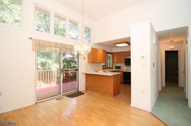 Chandelier, Interior, Kitchen, Recessed Lighting, Stainless Steel Appliances, Wood Texture Flooring