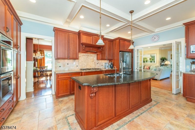 Chandelier, Dining room, Interior, Kitchen, Living room, Pendant Lights, Recessed Lighting, Stainless Steel Appliances