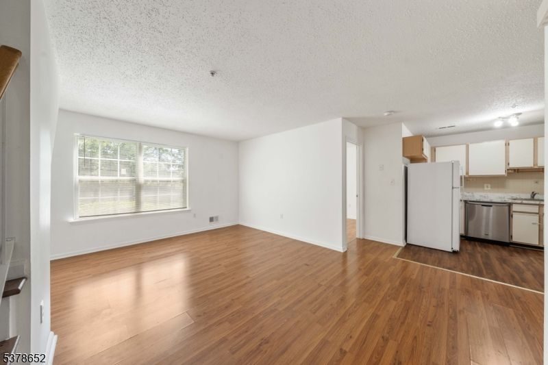 Empty room, Interior, Kitchen, Stainless Steel Appliances, Wood Texture Flooring