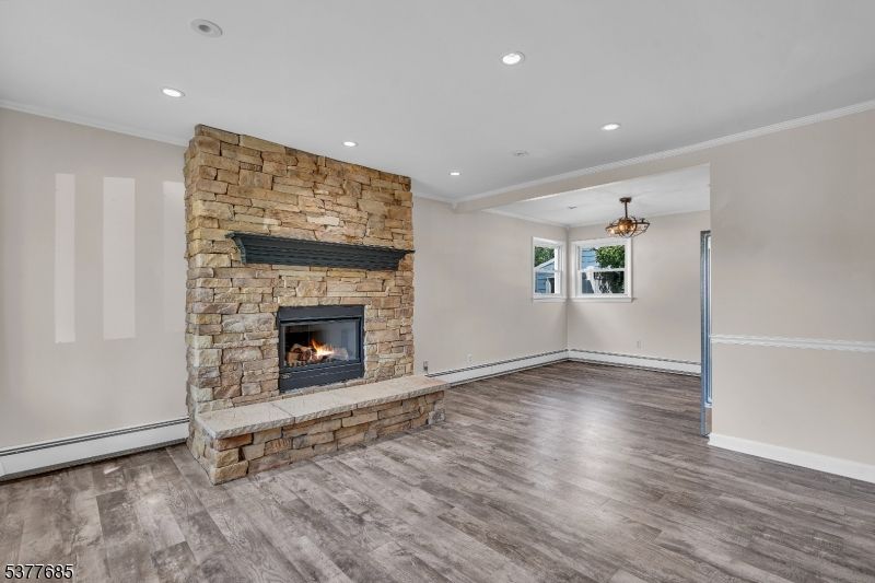 Empty room, Fireplace, Interior, Recessed Lighting, Stone Walls, Wood Texture Flooring