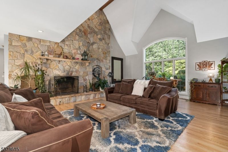 Fireplace, Interior, Living room, Recessed Lighting, Stone Walls, Wood Texture Flooring