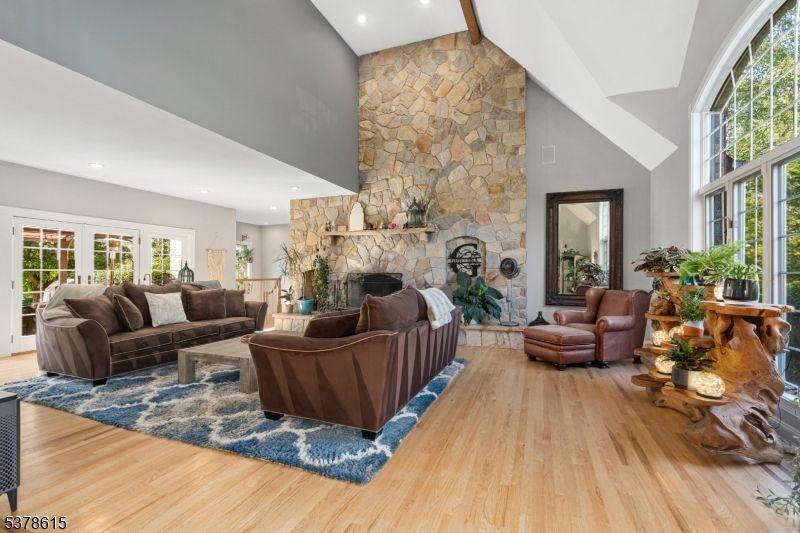 Fireplace, Interior, Living room, Recessed Lighting, Stone Walls, Wood Texture Flooring