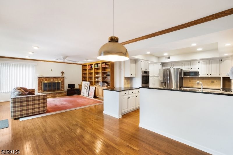 Fireplace, Interior, Kitchen, Pendant Lights, Recessed Lighting, Stainless Steel Appliances, Wood Texture Flooring