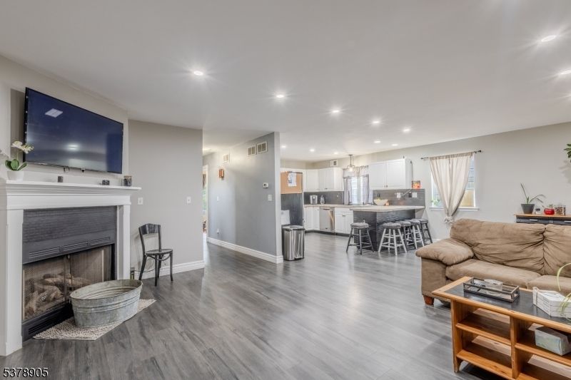 Dining room, Fireplace, Interior, Kitchen, Living room, Pendant Lights, Recessed Lighting, Wood Texture Flooring
