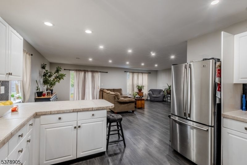 Interior, Kitchen, Living room, Recessed Lighting, Stainless Steel Appliances, Tile Countertops, Wood Texture Flooring