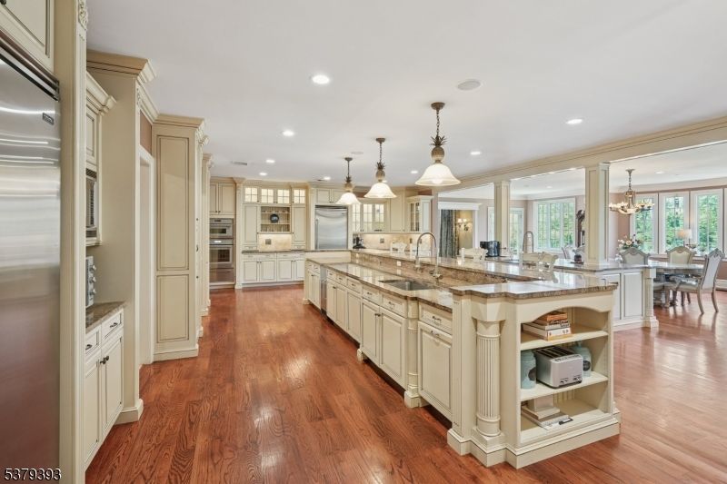 Chandelier, Dining room, Interior, Kitchen, Pendant Lights, Recessed Lighting, Stainless Steel Appliances, Wood Texture Flooring