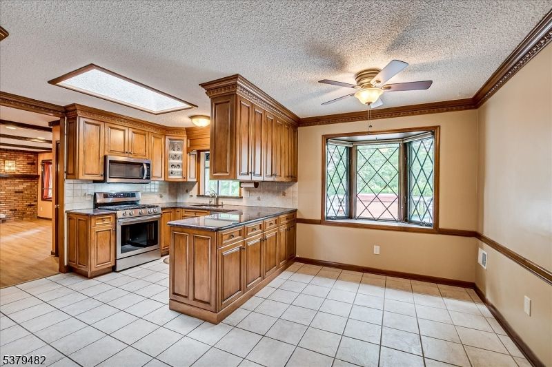 Interior, Kitchen, Stainless Steel Appliances, Stone Walls, Wood Texture Flooring