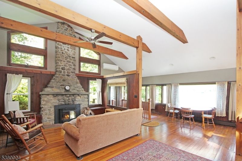 Dining room, Fireplace, Interior, Living room, Stone Walls, Wooden Beams, Wood Texture Flooring