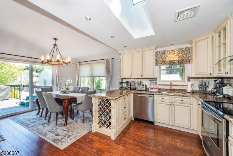Chandelier, Dining room, Interior, Kitchen, Recessed Lighting, Stainless Steel Appliances, Wood Texture Flooring