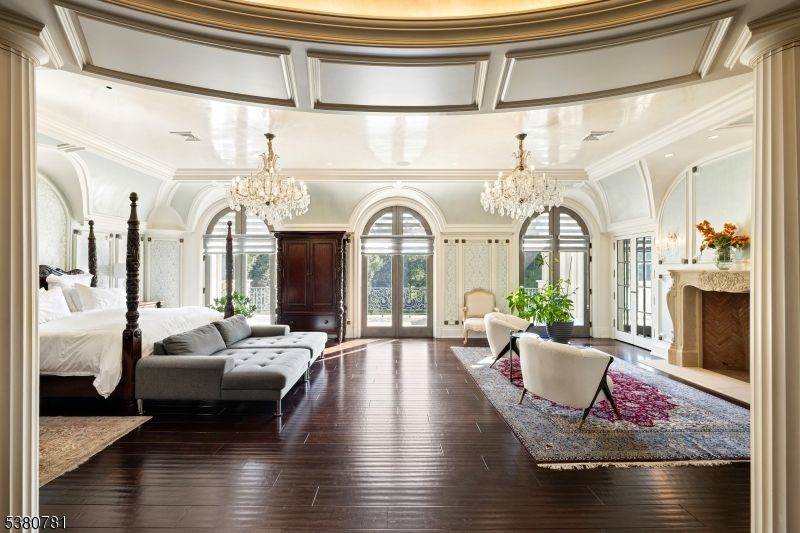 Bedroom, Chandelier, Fireplace, Interior, Recessed Lighting, Wood Texture Flooring