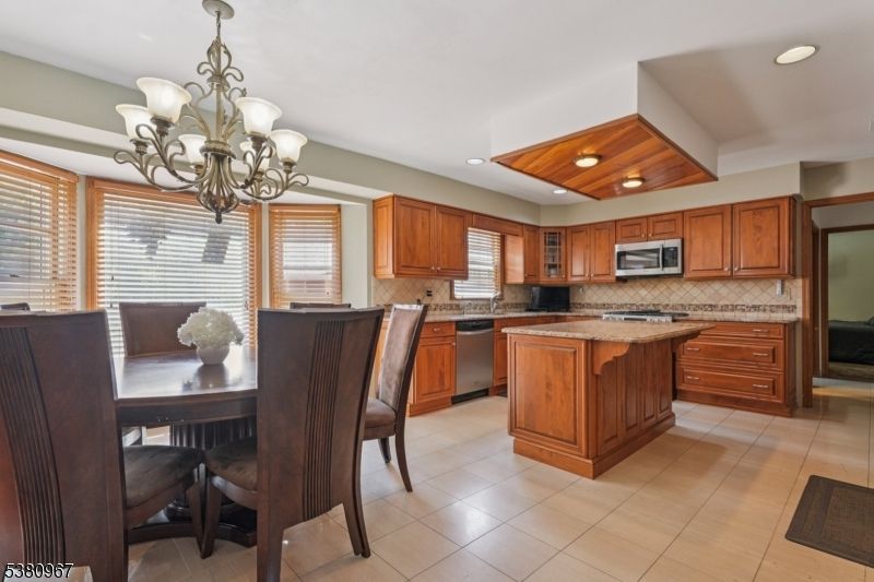 Chandelier, Dining room, Interior, Kitchen, Recessed Lighting, Stainless Steel Appliances, Wooden Ceilings