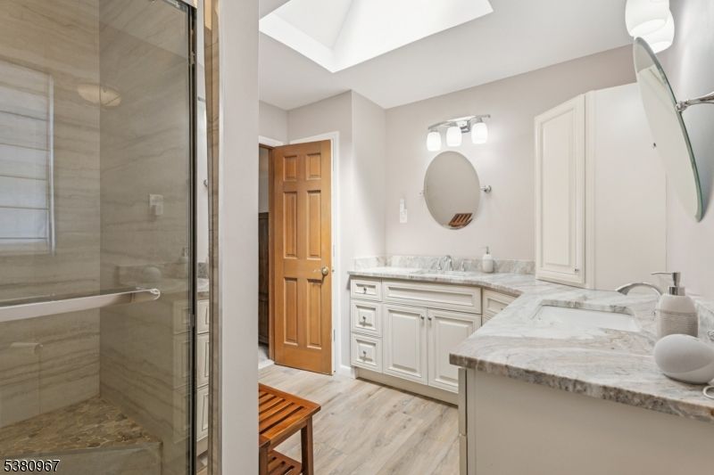 Bathroom, Dual Sink Vanities, Glass Shower, Interior, Wood Texture Flooring