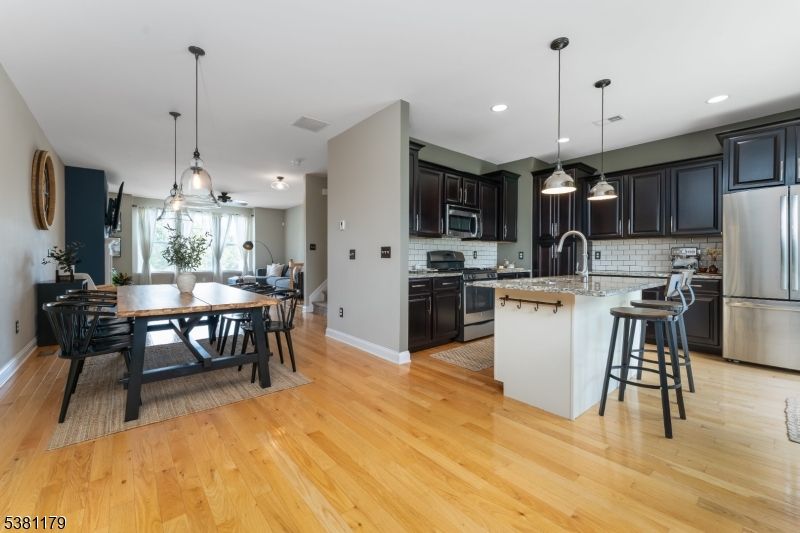 Dining room, Interior, Kitchen, Pendant Lights, Recessed Lighting, Stainless Steel Appliances, Wood Texture Flooring