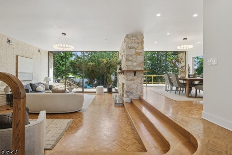 Chandelier, Dining room, Fireplace, Interior, Living room, Pendant Lights, Recessed Lighting, Wood Texture Flooring
