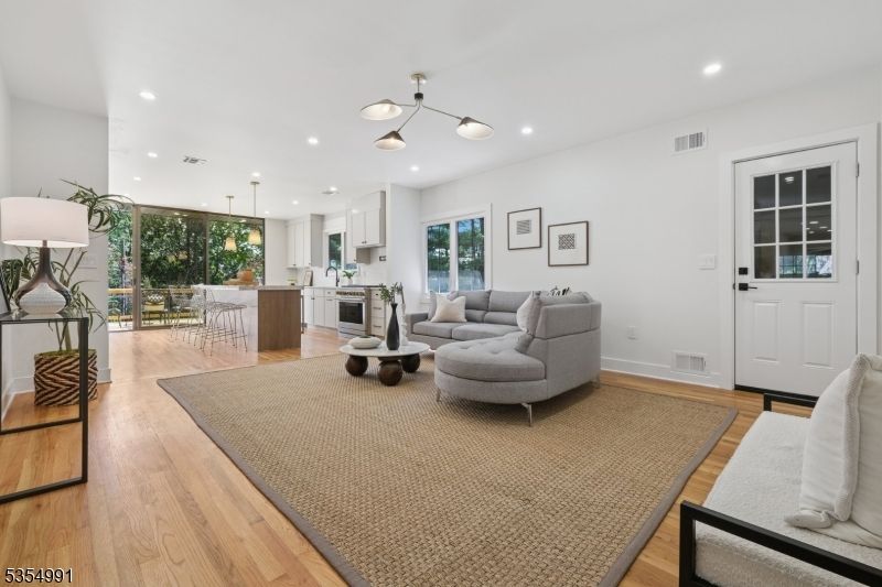 Dining room, Interior, Kitchen, Living room, Pendant Lights, Recessed Lighting, Stainless Steel Appliances, Wood Texture Flooring