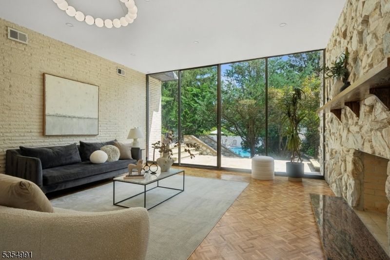 Fireplace, Interior, Living room, Recessed Lighting, Stone Walls, Wood Texture Flooring