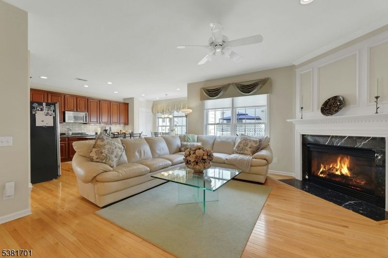 Chandelier, Fireplace, Interior, Kitchen, Living room, Recessed Lighting, Wood Texture Flooring