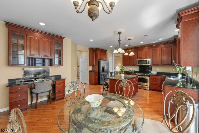 Dining room, Interior, Kitchen, Pendant Lights, Recessed Lighting, Stainless Steel Appliances, Wood Texture Flooring