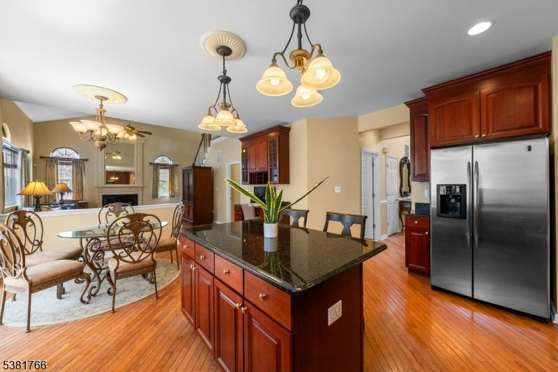 Chandelier, Dining room, Fireplace, Interior, Kitchen, Recessed Lighting, Wood Texture Flooring