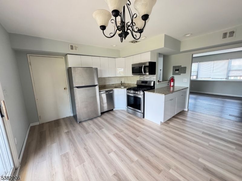 Chandelier, Interior, Kitchen, Stainless Steel Appliances, Wood Texture Flooring